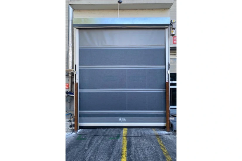 Factory Entrance High-Speed PVC Door High-speed PVC door installed at a factory entrance