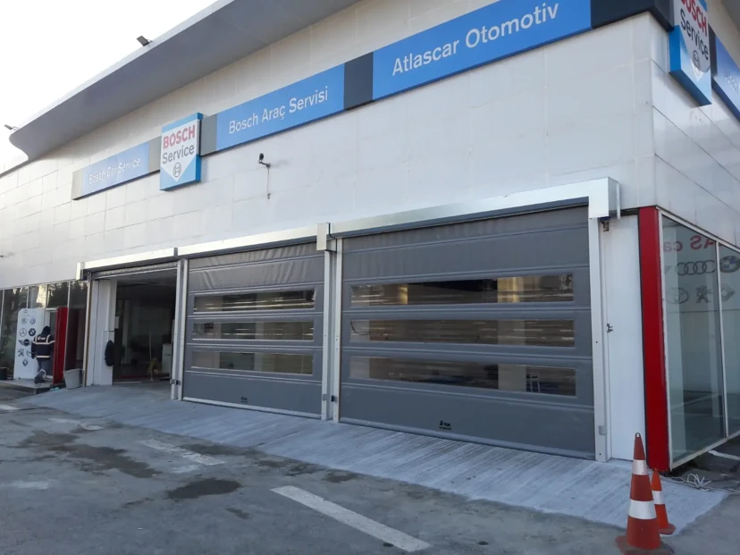 Open Service Entrance Transparent Rapid Roll-Up PVC Door Transparent rapid roll-up PVC door open at a service entrance
