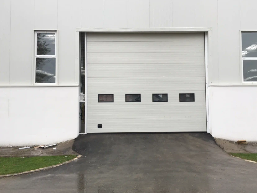 White Insulated Sectional Door with Windows White insulated industrial sectional door with windows