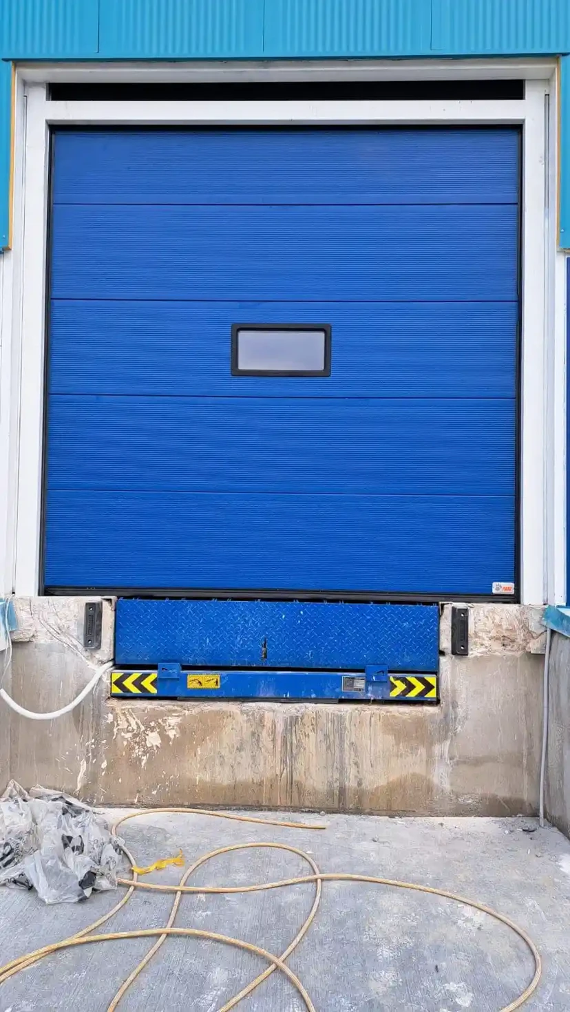 Sectional Door With Dock Leveler Sectional door with dock leveler