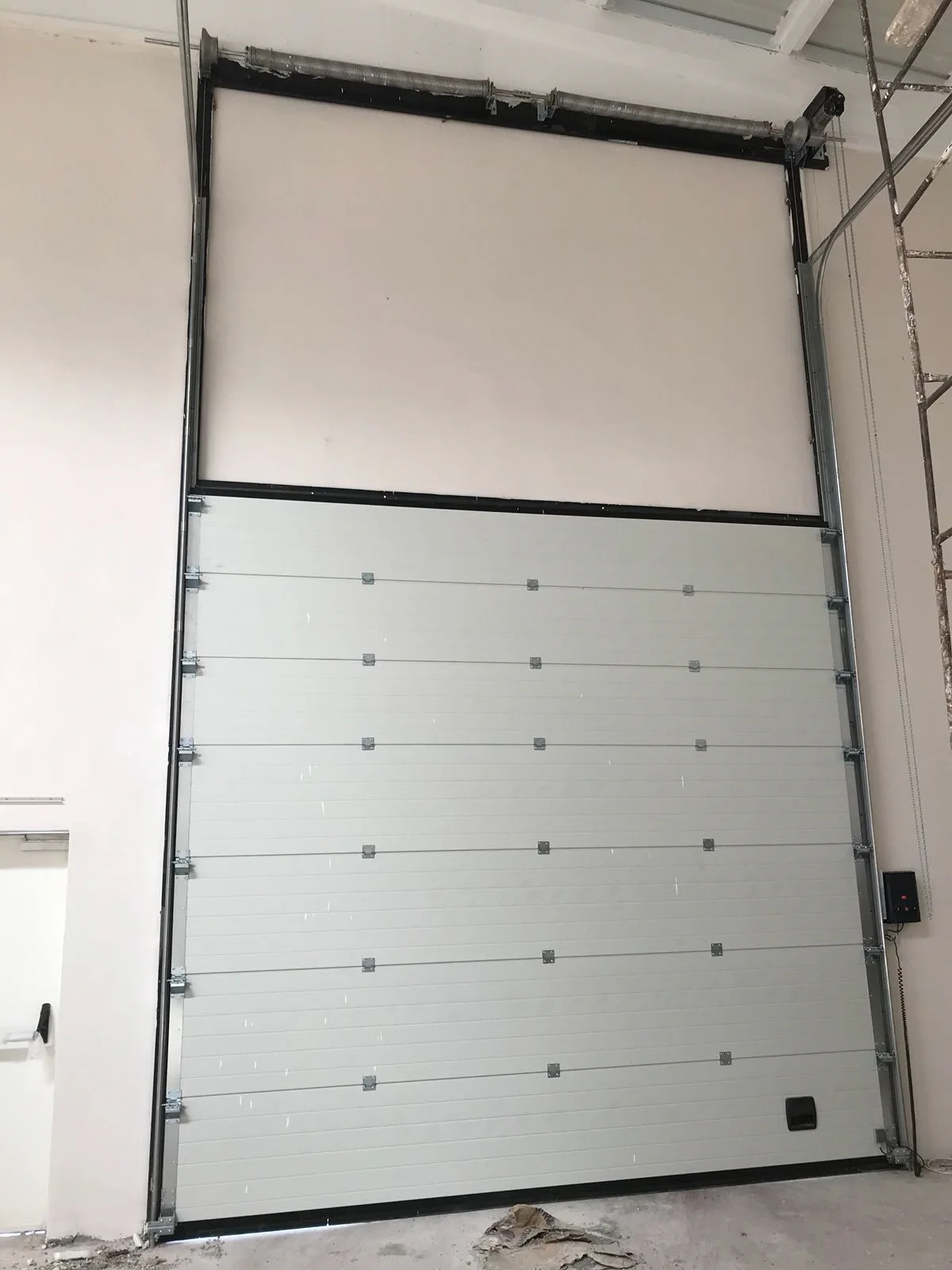 Sectional industrial door at a loading dock