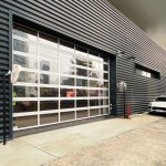 Enhancing visibility and aesthetics with full-view sectional doors. Full-view sectional door with aluminum frame and clear glass panels.